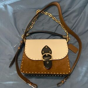 Multicolored Tan white and black Coach purse with 3 straps